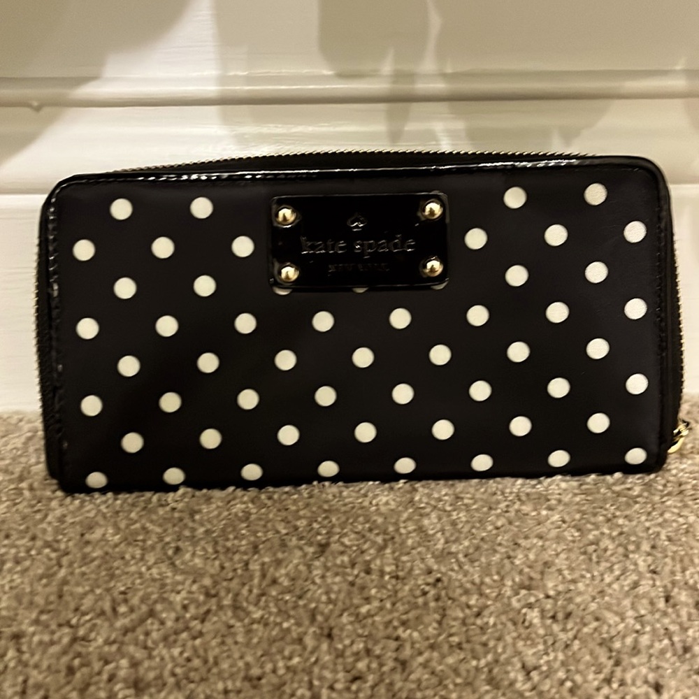 Perfect, never been used before full size wallet. Black with white polka dots